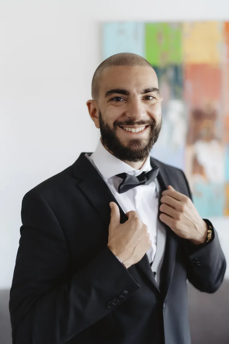 Luka Herceg smiling in a suit